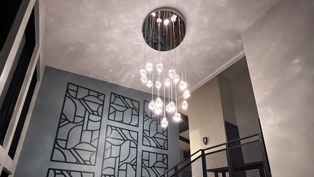 Silver chandelier hanging in a foyer